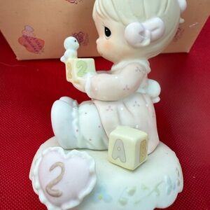 Precious Moments Pink and White Figurine
